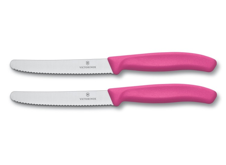 2 couteaux de table Victorinox lame 11cm à dents bout rond manche rose