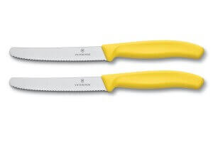 2 couteaux de table Victorinox jaunes lames crantées 11cm bout rond
